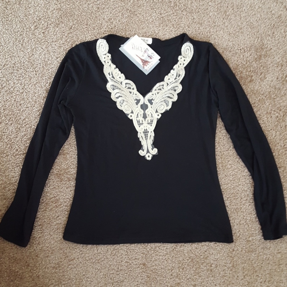 NWT Black long sleeve top with gold lace v-neck